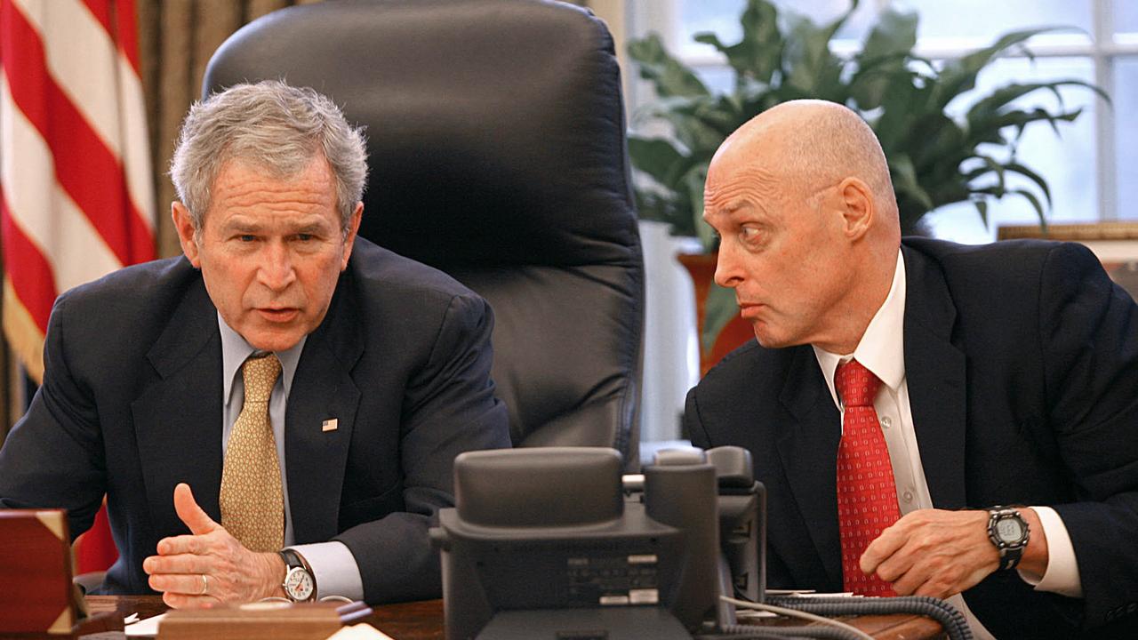 Former US President George W. Bush pictured with former US Secretary of the Treasury Hank Paulson. Picture: AFP Photo/The White House/Joyce N Boghosian