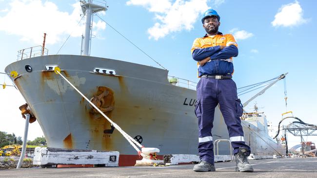 Glebe Island silo terminals operation lead Olufemi Adeyemi next to cement cargo ship Luga docked at Glebe island shipping port. Picture: Thomas Lisson