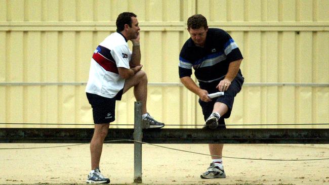 Ricky Stuart, left, in discussion with team coaching adviser Phil Gould in their Rooster days.