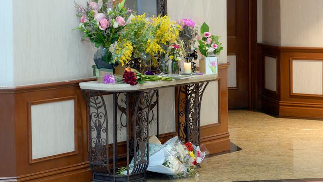 A tribute in flowers in the foyer where Mr Zaheer was fatally stabbed. Picture: Jeremy Piper