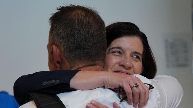 Hood hugs Clarkson after the announcement. Picture: Twitter/North Melbourne FC