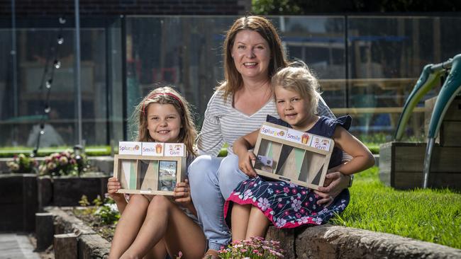 Mother-of-two Victoria Clark, 42, read the Barefoot Investor book and said it changed her life. She has also read the Barefoot for Families book and her daughters Sophie, 8, and Emily, 5. Picture: Jake Nowakowski