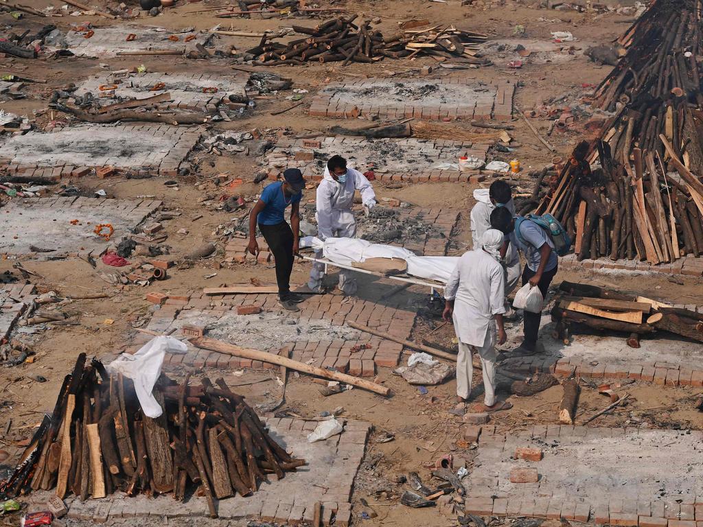 Relatives carry the body of a COVID victim to a cremation site in New Delhi on May 2, 2021. Picture: Tauseef Mustafa/AFP