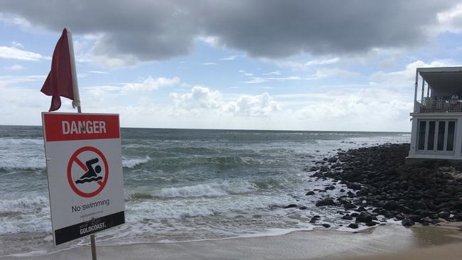 The red flag flying on the beach. Photo: John Affleck.