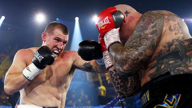 Paul Gallen punches Lucas Browne during their bout at WIN Entertainment Centre. Picture: Mark Metcalfe/Getty Images