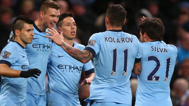 MANCHESTER, ENGLAND - FEBRUARY 21: Edin Dzeko of Manchester City celebrates scoring their third goal with team mates during the Barclays Premier League match between Manchester City and Newcastle United at Etihad Stadium on February 21, 2015 in Manchester, England. (Photo by Clive Brunskill/Getty Images)