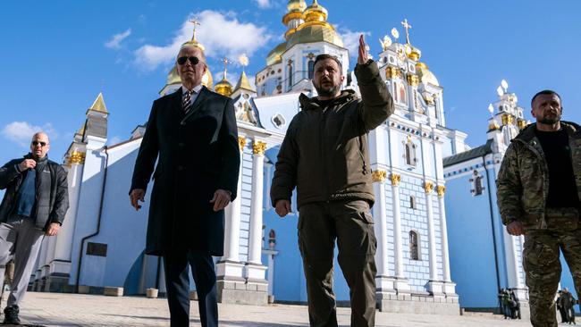 Joe Biden (C-L) walks with Ukrainian President Volodymyr Zelensky (C-R) at St. Michael's Golden-Domed Cathedral in Kyiv. Picture: AFP.