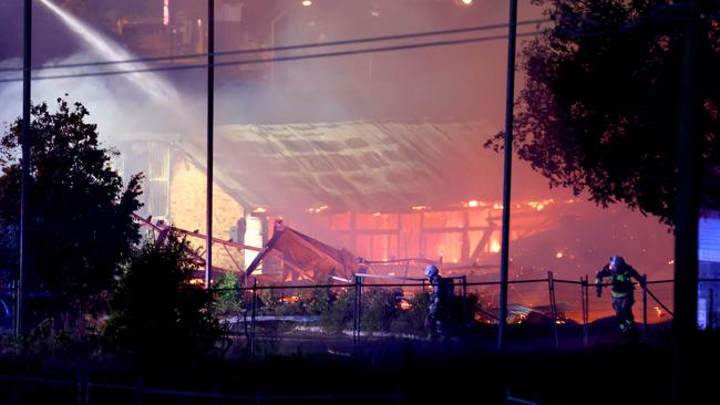 Multiple fire units spray water on buildings on fire in Hubert St, Gabba – on Wednesday 25th of September – Photo Steve Pohlner