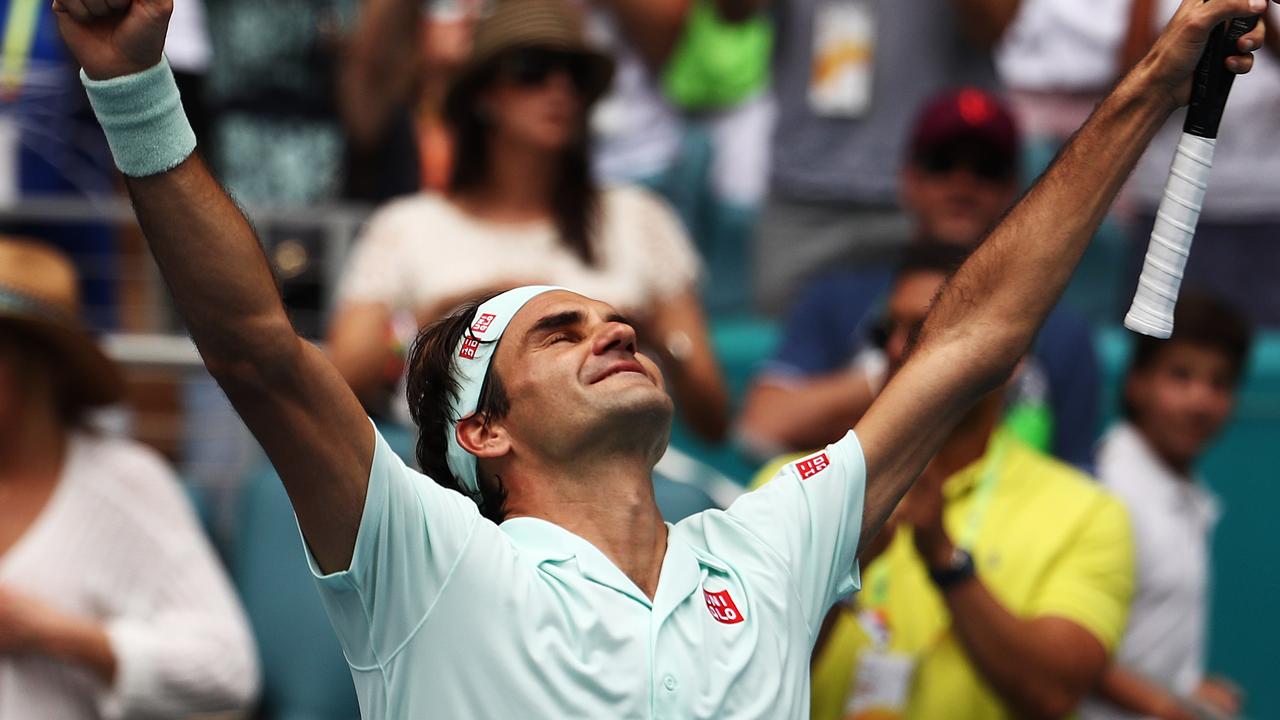 Roger Federer celebrates after defeating John Isner in straight sets to claim his 101st career title.
