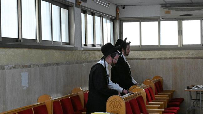 Many Haredi men choose to study holy texts in religious seminaries instead of working regularly. Picture: Tanya Habjouqa/Noor Images for WSJ