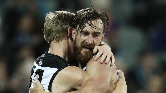 Charlie Dixon hugs Todd Marshall after kicking a goal. Picture: Sarah Reed