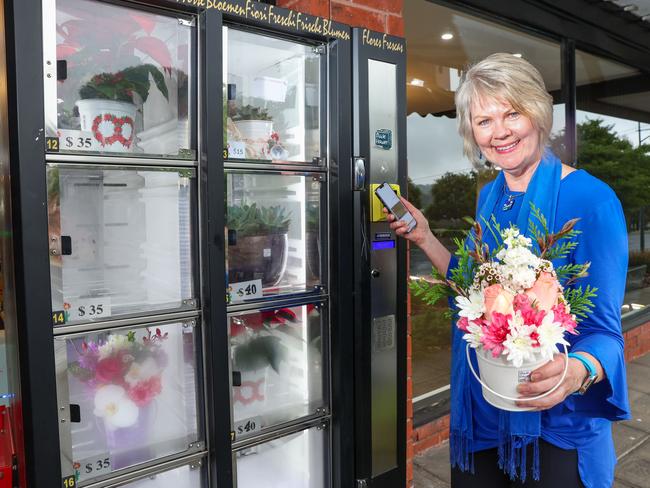 MELBOURNE, AUSTRALIA - NOVEMBER 25 2024Christine Heart Savage buys flowers from Little Flower Box in Templestowe who are doing vending machines for flowers.Picture: Brendan Beckett