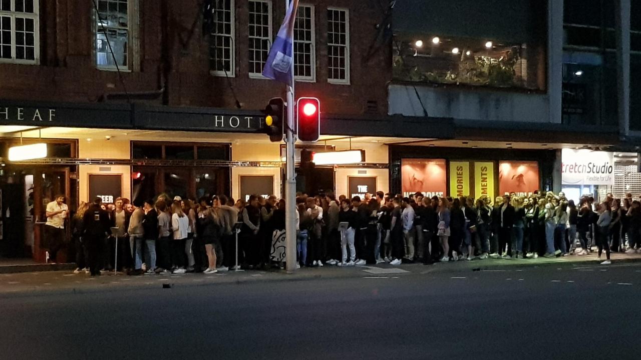 Last week, this photo of a crowd queuing outside The Golden Sheaf Hotel in Sydney’s Double Bay went viral. Source: Reddit