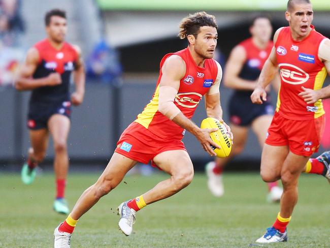 Jarrod Harbrow of the Suns runs with the ball during the round 20 AFL match between the Melbourne Demons and the Gold Coast Suns at Melbourne Cricket Ground on August 5, 2018 in Melbourne, Australia. Picture: Michael Dodge/Getty Images.