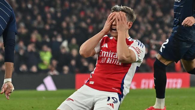 Arsenal's Belgian midfielder #19 Leandro Trossard reacts after missing a chance during the English Premier League football match between Arsenal and Aston Villa at the Emirates Stadium in London on January 18, 2025. (Photo by Glyn KIRK / AFP) / RESTRICTED TO EDITORIAL USE. No use with unauthorized audio, video, data, fixture lists, club/league logos or 'live' services. Online in-match use limited to 120 images. An additional 40 images may be used in extra time. No video emulation. Social media in-match use limited to 120 images. An additional 40 images may be used in extra time. No use in betting publications, games or single club/league/player publications. /