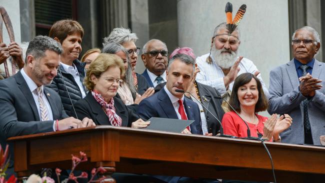 Attorney General Kyam Maher, left, Governor Frances Adamson, Premier Peter Malinauskas and deputy Premier Susan Close sign the bill on the steps of Parliament House to pass the nation’s first Voice to parliament. Picture: NCA NewsWire / Brenton Edwards