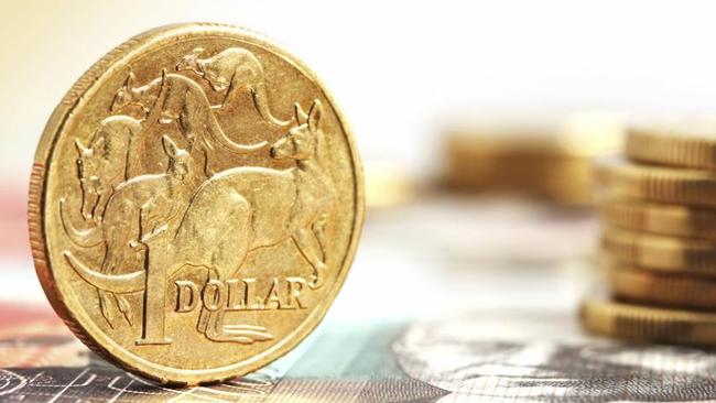 Aussie one dollar coins, on a twenty dollar note.