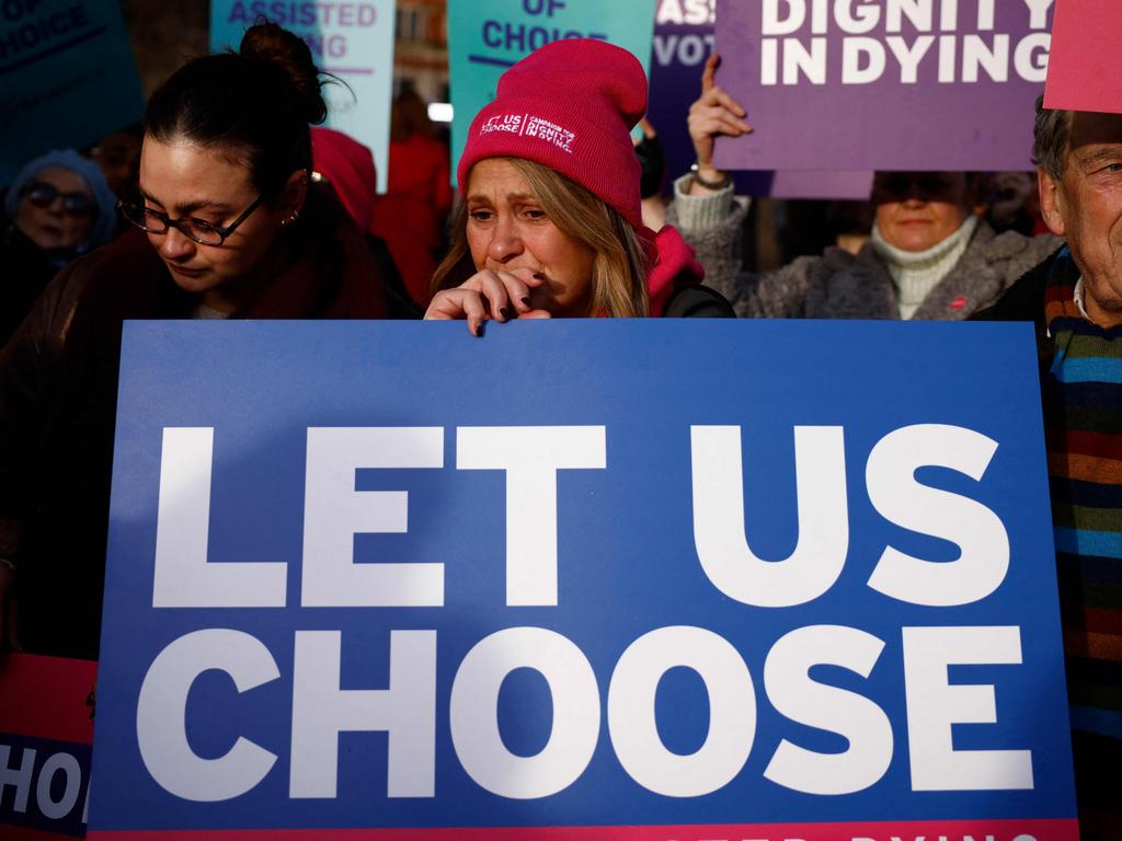 A nearby gathering in favour of the legislation saw people dressed in pink holding placards with slogans such as: ‘My life, my death, my choice’. Picture: Benjamin Cremel/AFP