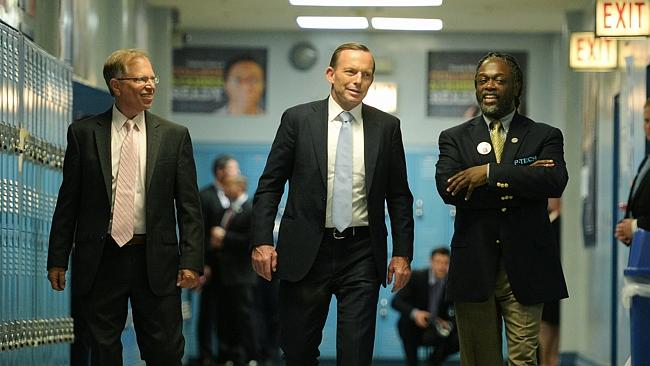 Looks good to me: Tony Abbott, Stanley Litow from IBM and P-TECH school principal Rashid Ferrod Davis during a tour of the innovative school in New York last week. Picture: Jake Nowakowski
