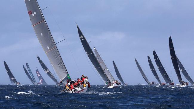 Yachts heading out into open sea at the start of the race.