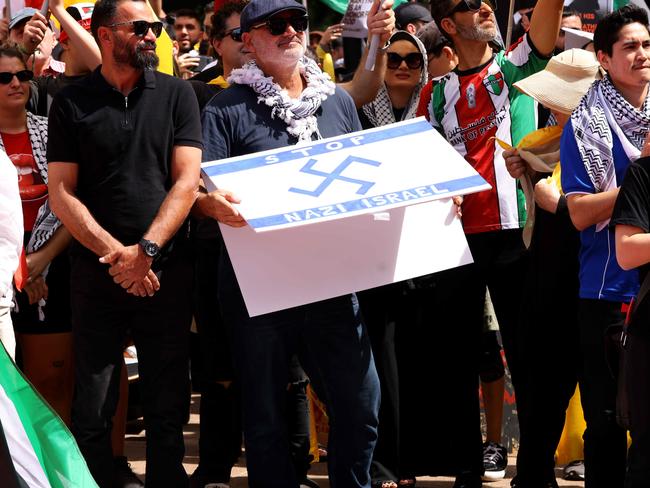 Yazbek at Sunday’s protest holding the alleged sign. There is no suggestion of wrongdoing by others in the photograph. Picture: NewsWire