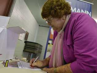 BRING IT BACK: Peggy Frankish signs the petition. Picture: Inga Williams