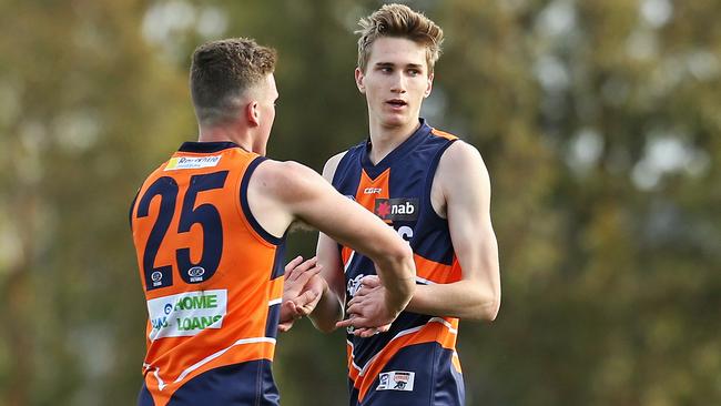 Jack Keeping celebrates a goal with Jacob Martin.