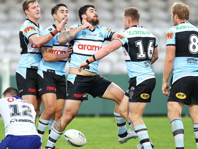 SYDNEY, AUSTRALIA - JULY 11:  Braden Hamlin-Uele of the Sharks pretends to knock out Jack Williams of the Sharks as part of his post try celebration during the round 17 NRL match between the Cronulla Sharks and the New Zealand Warriors at Netstrata Jubilee Stadium, on July 11, 2021, in Sydney, Australia. (Photo by Mark Kolbe/Getty Images)