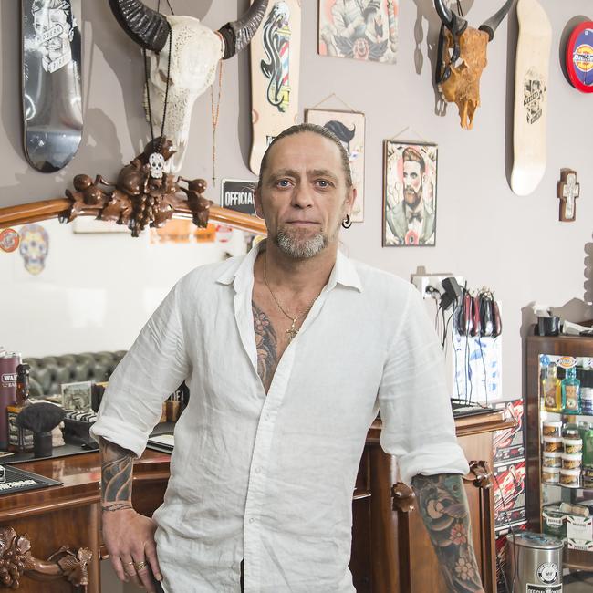 Barber Michael Smith at his Long Jetty barbershop. Picture: Troy Snook