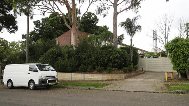 A large gate across the driveway of the housing commission block was intended to keep out unwanted visitors. Picture: John Grainger