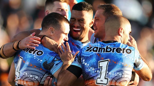 Connor Tracey of the Sharks celebrates with his teammates after scoring a try during the round 12 NRL match between Cronulla and Newcastle at Coffs Harbour International Stadium on May 20, 2023. Picture: Mark Kolbe/Getty Images