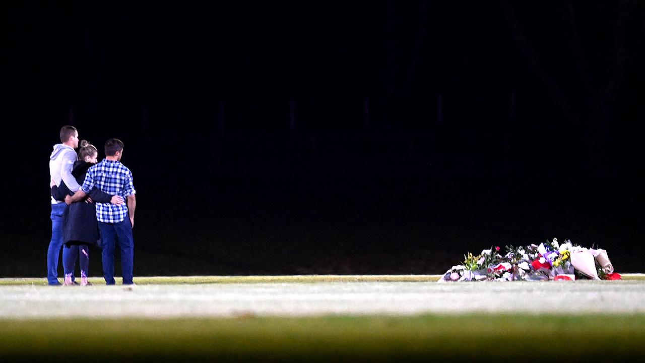 Team mates and friends of the Singleton Roosters Aussie Rules Club gathered for a vigil at their home ground on Tuesday night. Picture: Jeremy Piper