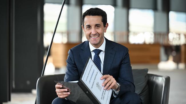 Premier David Crisafulli with the official premiers’ portfolio of incoming government briefs. Picture: Lyndon Mechielsen