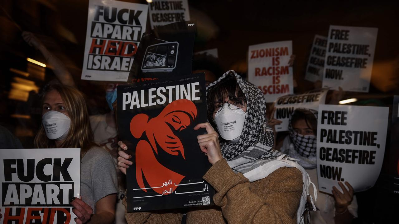 Pro-Palestinian students hold a sit-in in Melbourne on May 15, 2024 at Melbourne University's Arts West building, which the students have temporarily renamed as "Mahmoud's Hall" after Mahmoud Al Haq, a prospective University of Melbourne student, who died in Gaza. (Photo by Martin KEEP / AFP)