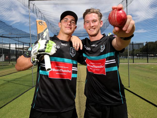 Boyd Woodcock and Kane Farrell pose for a photograph during a Port Adelaide Football Club cricket training session at Adelaide Oval in Adelaide, Tuesday, January 28, 2020. (AAP Image/Kelly Barnes) NO ARCHIVING