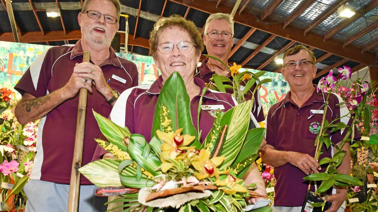 SMELL THE FLOWERS: Hervey Bay Orchid Society's Rob Anderson, Carol Jenkins, Giles Blaber and Keith Lyiadat at the Hervey Bay Spring Orchid and Garden Spectacular on Friday. Picture: Cody Fox