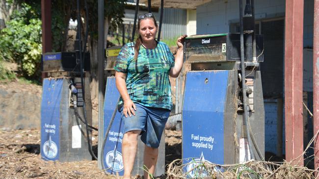 Wujal Wujal Aboriginal Shire chief executive Kiley Hanslow. pictured at the ruins of the town's petrol station, and her partner Lawrence Fry are the only residents left in town since the evacuation following the flood. Picture: Bronwyn Farr