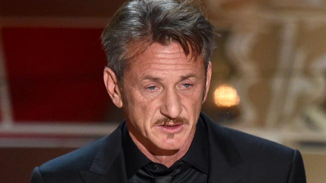 FILE - In this Feb. 22, 2015 file photo, actor Sean Penn presents the award for best picture to Mexican-born Alejandro Iñárritu for his film, "Birdman: Or (The Unexpected Virtue of Ignorance)," at the Oscars at the Dolby Theatre in Los Angeles. On Saturday, March 7, during a promotional tour for his new film “The Gunman,” in Beverly Hills, Penn opened up about the green card joke he made during the Oscars saying that he has “absolutely no apologies” for his comment. “I found it hilarious,” Iñárritu said after the ceremony. “Sean and I have that kind of brutal (relationship) where only true friendship can survive.” Iñárritu directed Penn in the 2003 film “21 Grams” and the two remain close to this date. (Photo by John Shearer/Invision/AP, File)