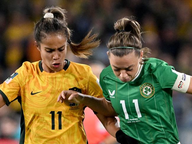 SYDNEY, AUSTRALIA - JULY 20: Mary Fowler of Australia and Katie McCabe of Republic of Ireland compete for the ball  during the FIFA Women's World Cup Australia & New Zealand 2023 Group B match between Australia and Ireland at Stadium Australia on July 20, 2023 in Sydney, Australia. (Photo by Bradley Kanaris/Getty Images)