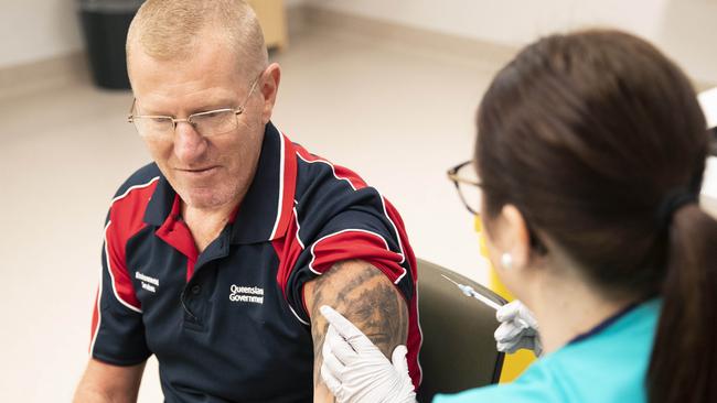 Gold Coast Health staffer, Phillip Bayes, getting one of the first Pfizer vaccines at the Gold Coast University Hospital at the end of February. Picture: NIGEL HALLETT