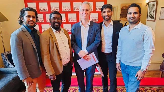 Multicultural Affairs Minister Andrew Giles, centre, with Tamil community leaders, including Raj Saini, second left