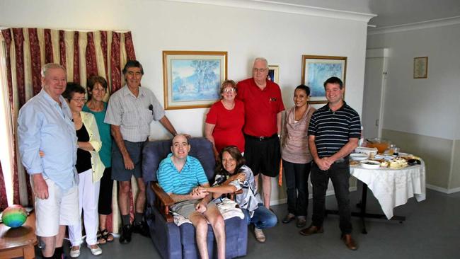 SMILES ALL ROUND: Lachlan Perry, centre, celebrates with friends and family at his Gatton home. Picture: Dominic Elsome