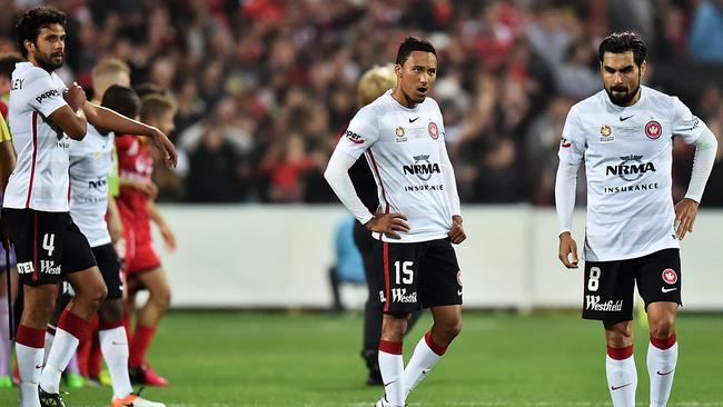Western Sydney Wanderers players (l-r) Nikolai Topor-Stanley, Kearny Baccus and Dimas after the grand final loss.