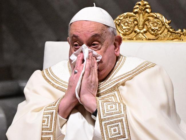 Pope Francis blows his nose during the vespers at St Peter's basilica in The Vatican, on February 1, 2025. (Photo by Tiziana FABI / AFP)