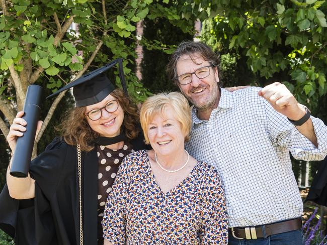 Graduate Fiona Stone with parents Jennifer Callaghan and Hugh Stone at a UniSQ graduation ceremony at Empire Theatres, Tuesday, October 31, 2023. Picture: Kevin Farmer