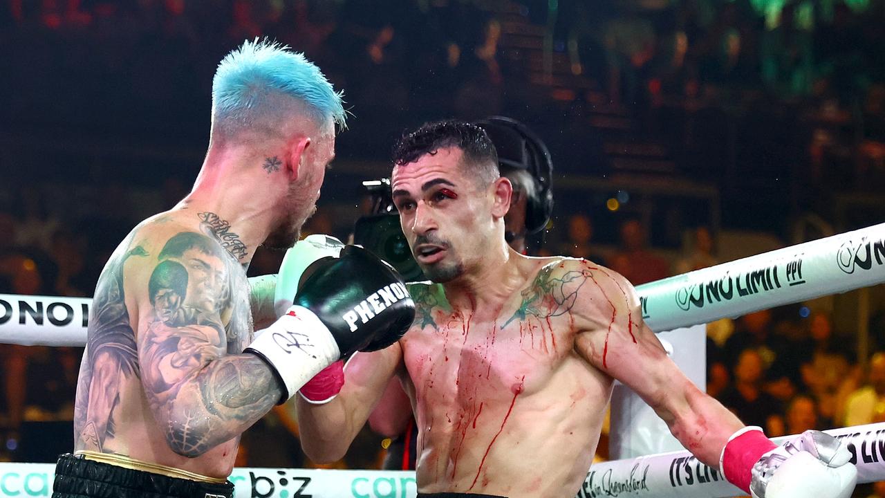 Justin Frost (left) works Hassan Hamdan in the corner during their fight. Picture: Getty Images