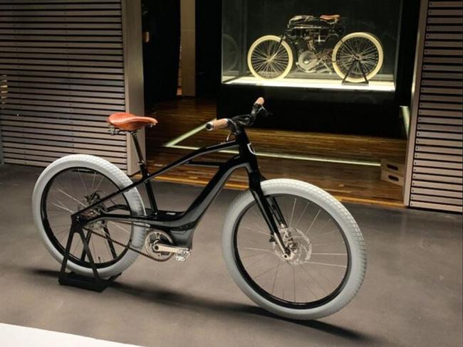 The new ebike, with the historic motorcycle it's inspired by in the background.