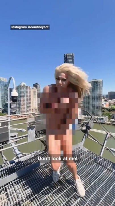 Courtney Act strips naked at Aussie landmark