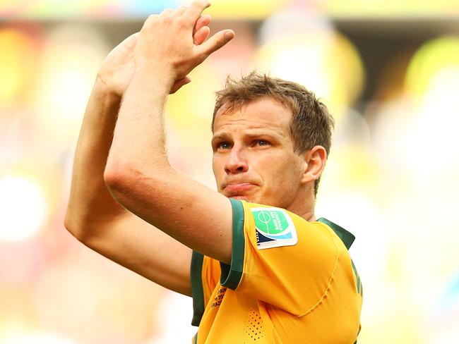 CURITIBA, BRAZIL - JUNE 23: Alex Wilkinson of Australia acknowledges the crowd after being defeated by Spain 3-0 during the 2014 FIFA World Cup Brazil Group B match between Australia and Spain at Arena da Baixada on June 23, 2014 in Curitiba, Brazil. (Photo by Cameron Spencer/Getty Images)