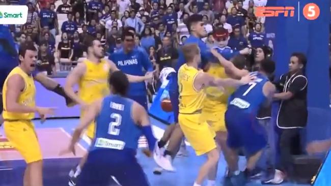 A bench player from the Philippines who has made his way onto the court lands a forearm to Kickert temple.